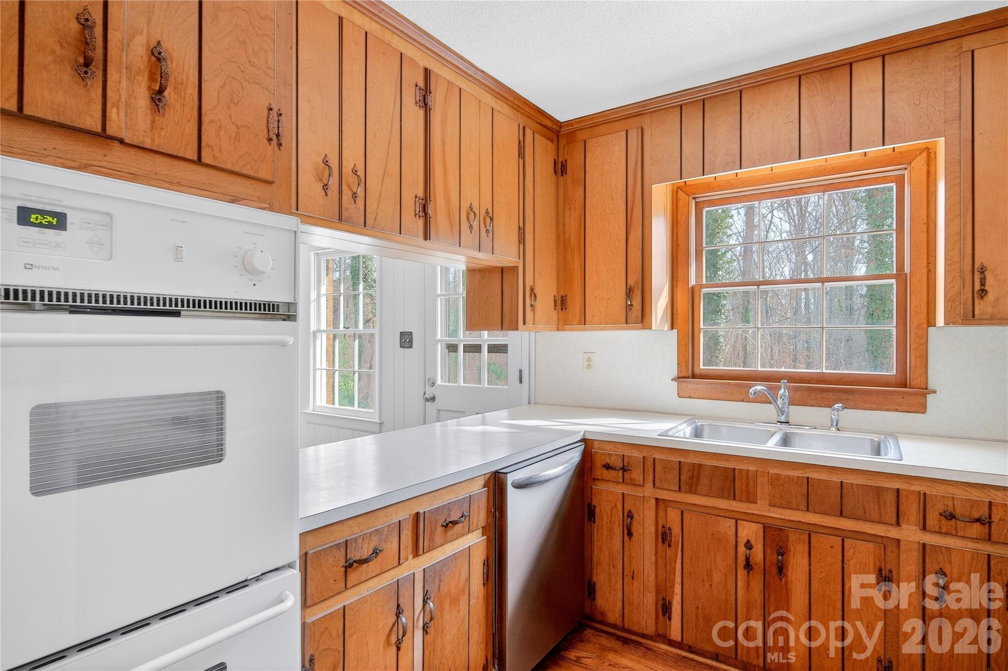 852 Fieldstone Road Mooresville, NC 28115 - Photo 12 of 34 a kitchen with stainless steel appliances granite countertop a sink and a cabinets