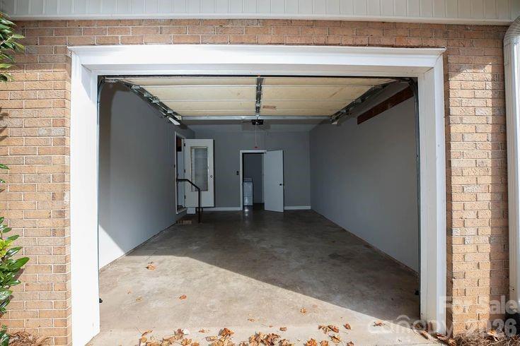 852 Fieldstone Road Mooresville, NC 28115 - Photo 13 of 13 a view of a hallway with wooden floor and a ceiling fan