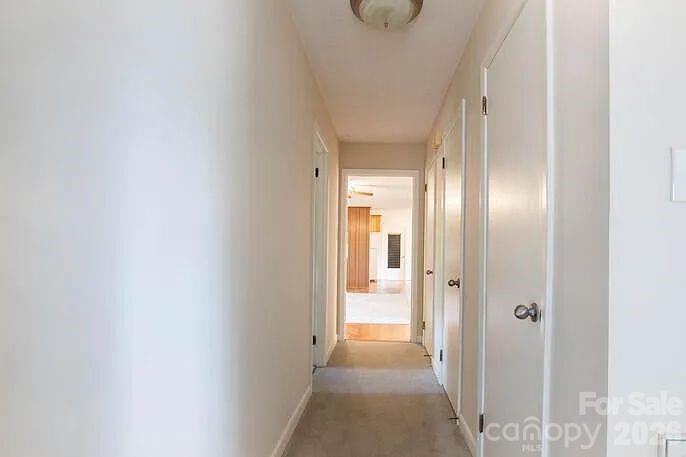 852 Fieldstone Road Mooresville, NC 28115 - Photo 7 of 13 a view of a hallway with wooden floor
