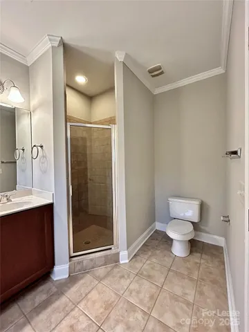 a bathroom with a toilet sink and shower