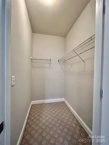 a view of a room with racks on the wall