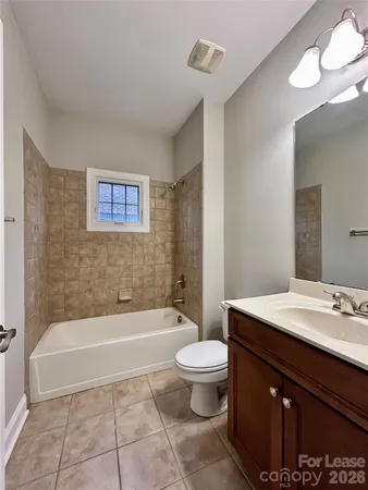 a bathroom with a sink a toilet and bathtub