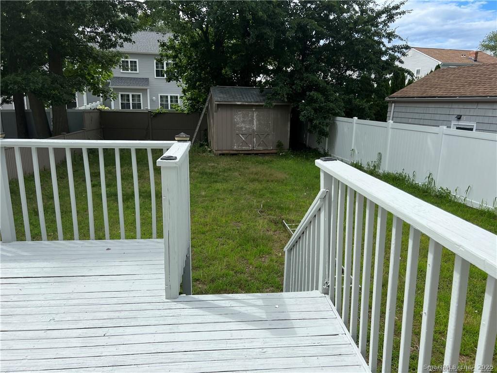144 Rakoczy Avenue Fairfield, CT 06824 - Photo 19 of 19 a view of a house with backyard and deck