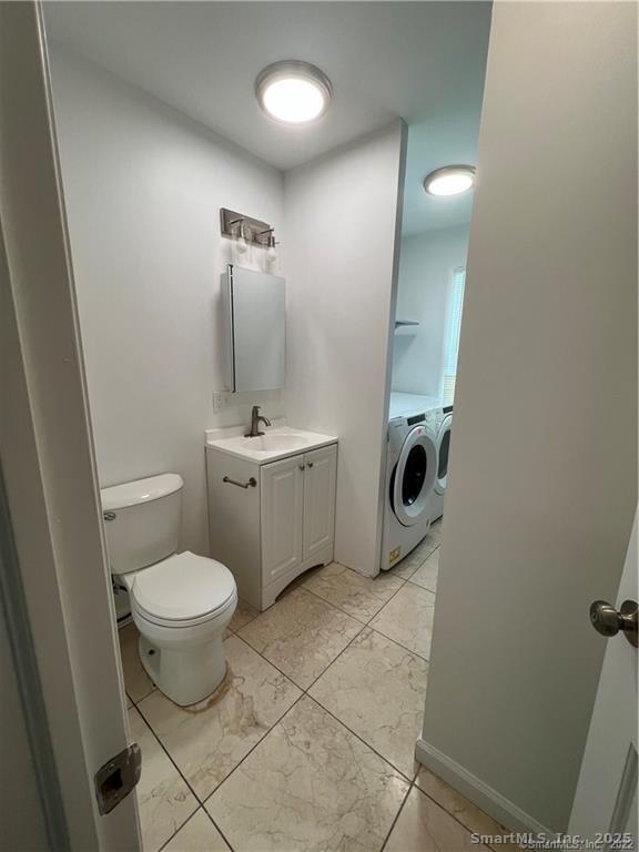 144 Rakoczy Avenue Fairfield, CT 06824 - Photo 6 of 19 a bathroom with a sink toilet and shower