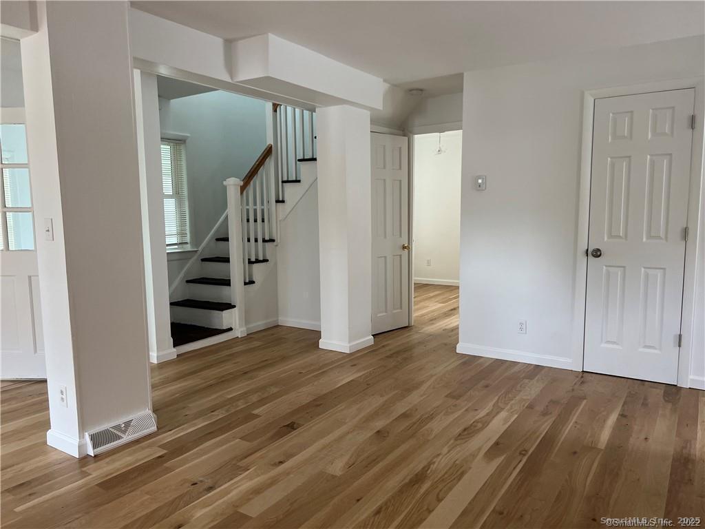 144 Rakoczy Avenue Fairfield, CT 06824 - Photo 7 of 19 a view of entryway with wooden floor
