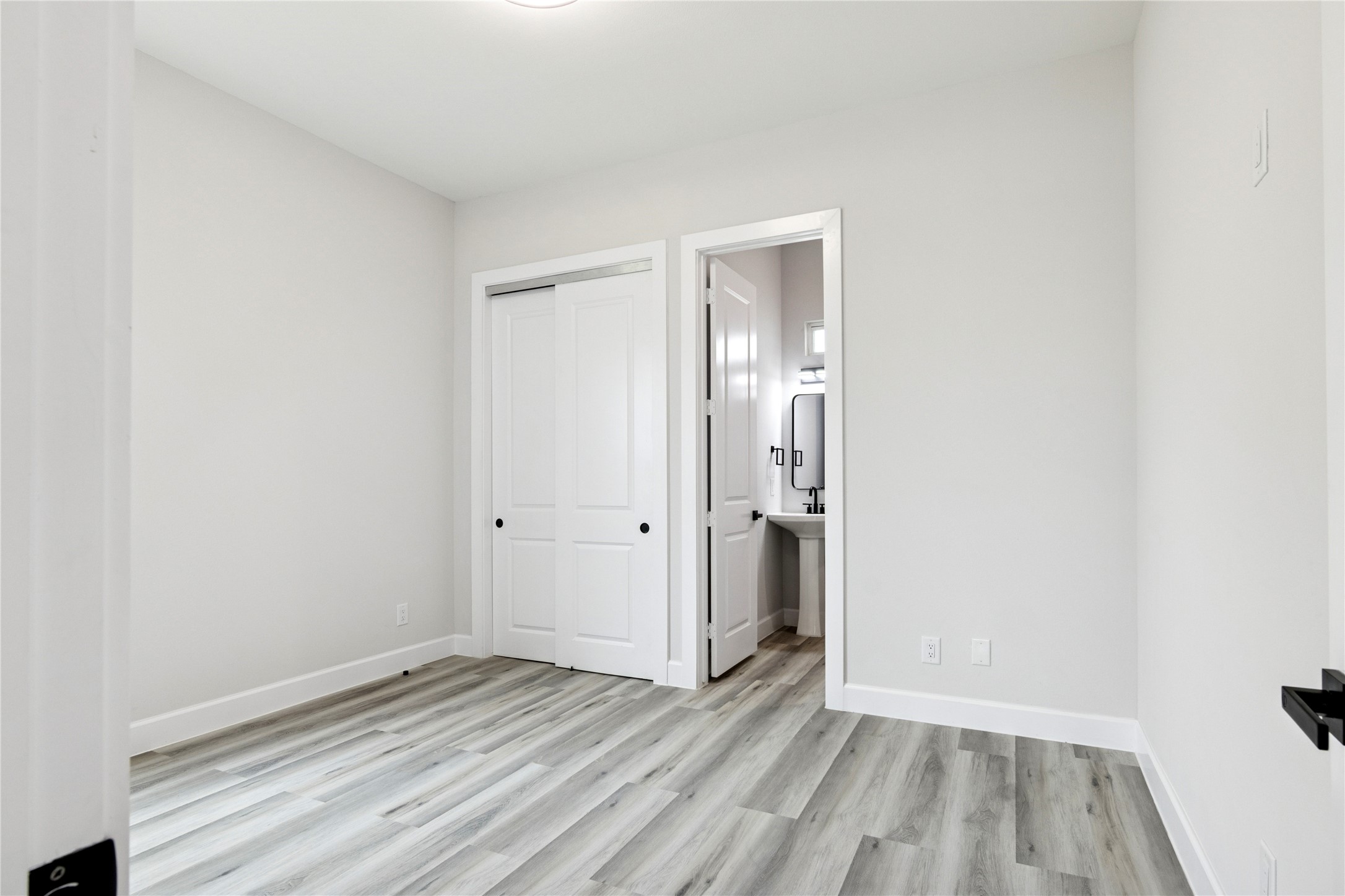 5766 Ward Bend Road Sealy, TX 77474 - Photo 24 of 45 a view of an empty room and wooden floor