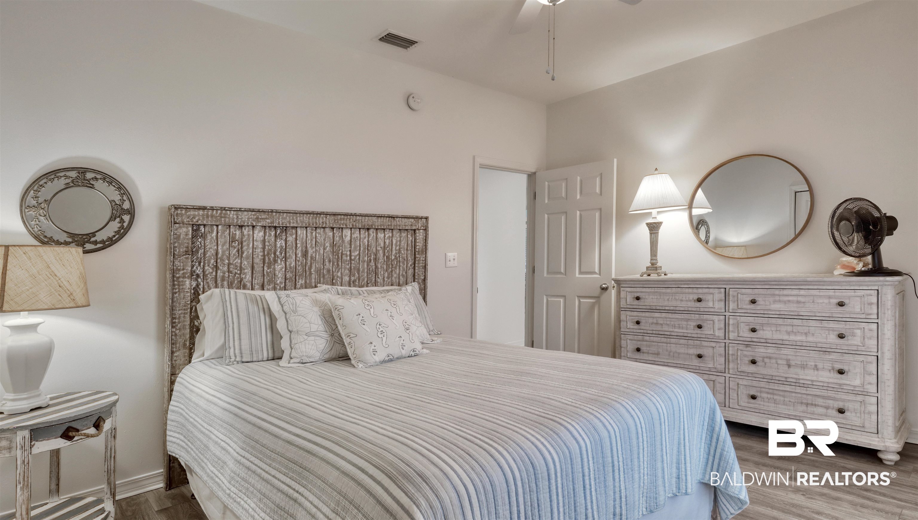 26063 Canal Road, Unit C2 Orange Beach, AL 36561 - Photo 20 of 30 Bedroom featuring wood finished floors and ceiling fan