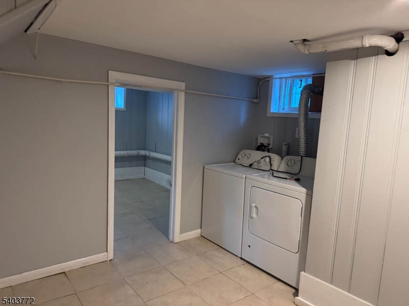 351 Ogden Street Orange, NJ 07050 - Photo 11 of 13 a view of storage and utility room with washer and dryer