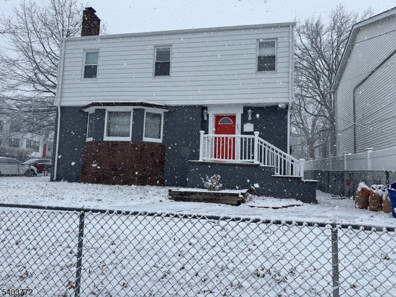 351 Ogden Street Orange, NJ 07050 - Photo 13 of 13 a front view of a house with a yard