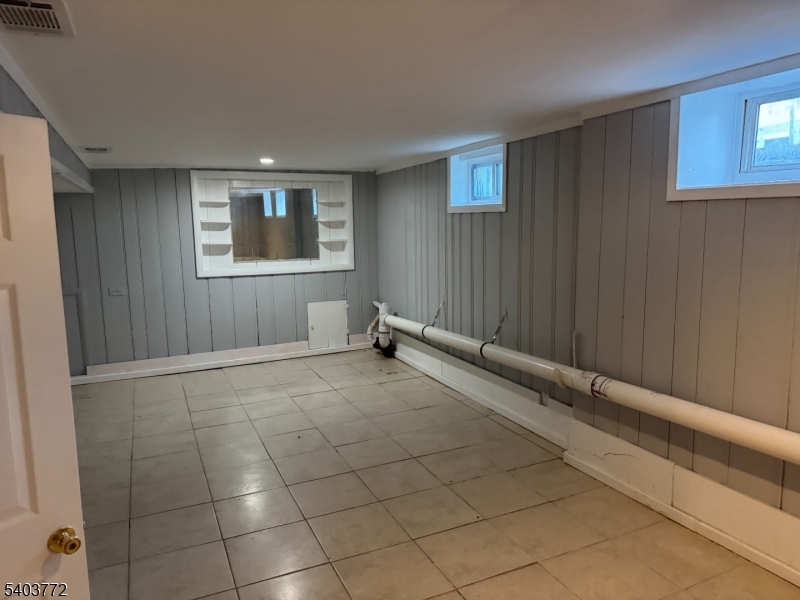 351 Ogden Street Orange, NJ 07050 - Photo 10 of 13 a view of an empty room with a window