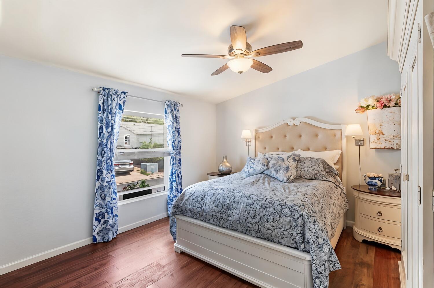 1400 West Marlette Street, Unit 45 Ione, CA 95640 - Photo 16 of 41 a bedroom with a bed and wooden floor