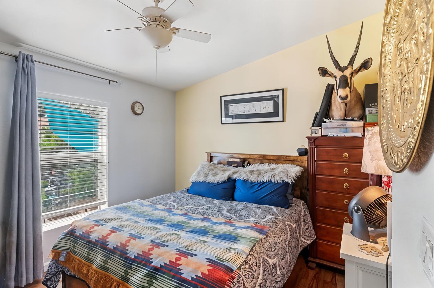 1400 West Marlette Street, Unit 45 Ione, CA 95640 - Photo 23 of 41 a bedroom with a bed and a chandelier