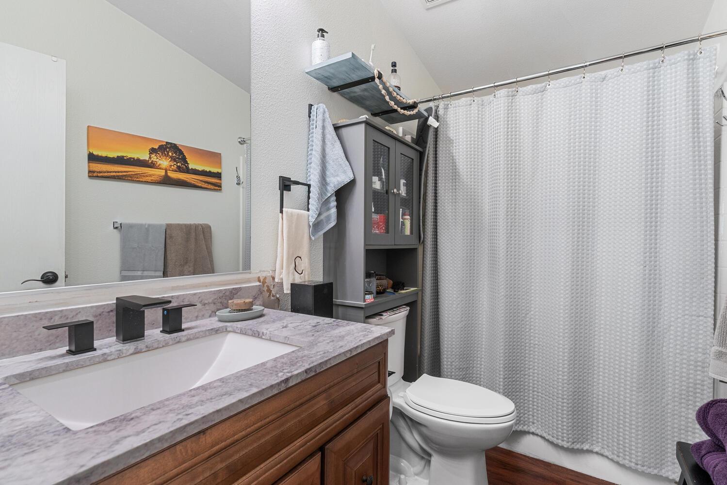 1400 West Marlette Street, Unit 45 Ione, CA 95640 - Photo 24 of 41 a bathroom with a granite countertop sink toilet and shower