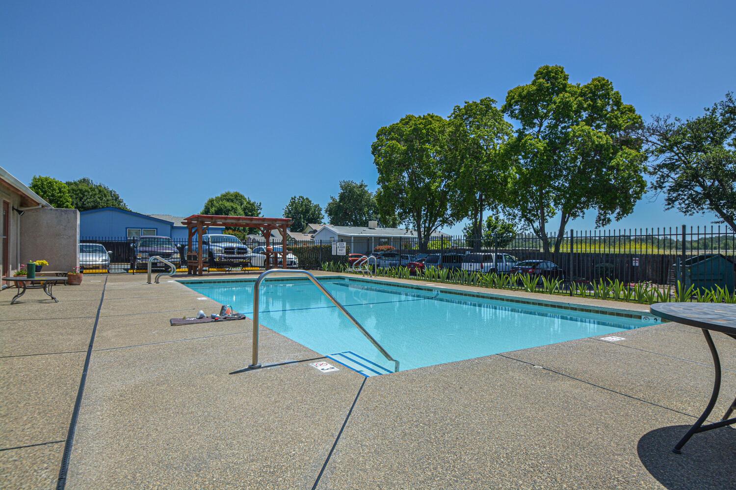 1400 West Marlette Street, Unit 45 Ione, CA 95640 - Photo 38 of 41 a view of a swimming pool with a lounge chair
