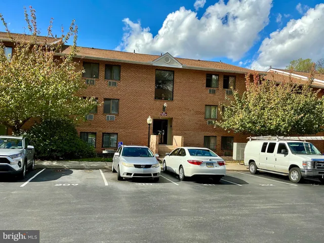 a view of a car parked in front of a house