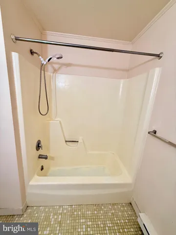 a bathroom with a bath tub