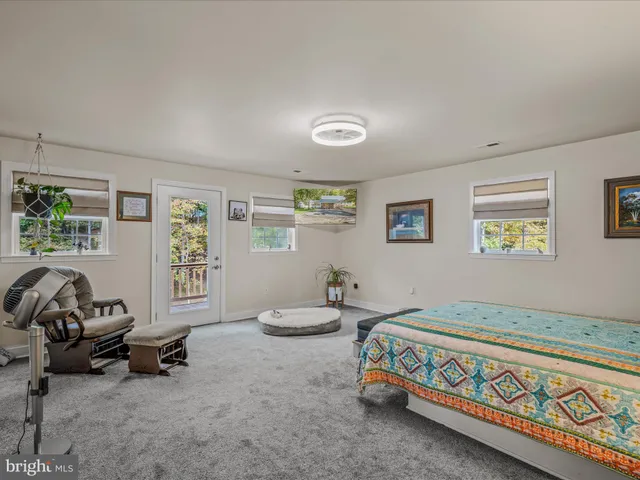 a bedroom with a bed and a couch