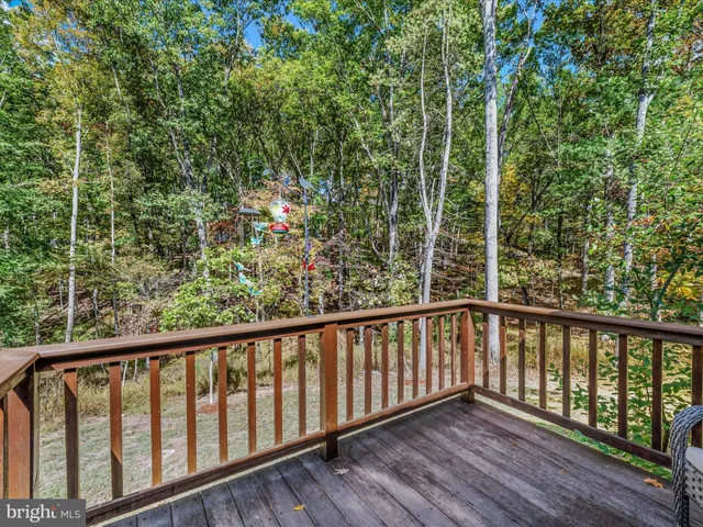 a view of a balcony with wooden floor