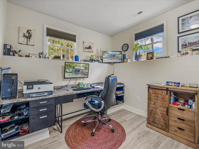 a workspace with furniture and window