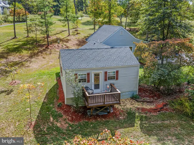 a aerial view of a house with a yard