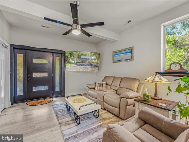 a living room with furniture and a window