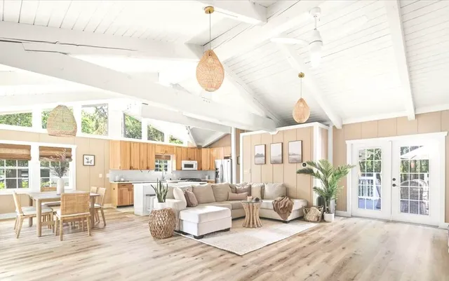 a bedroom with furniture and wooden floor