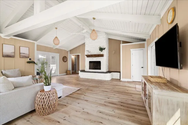 a living room with furniture fireplace and flat screen tv