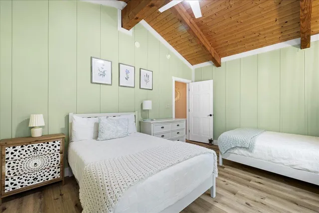 a bedroom with a bed and a couch