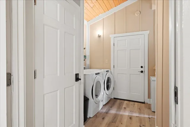 a view of a storage and utility room with washer and dryer