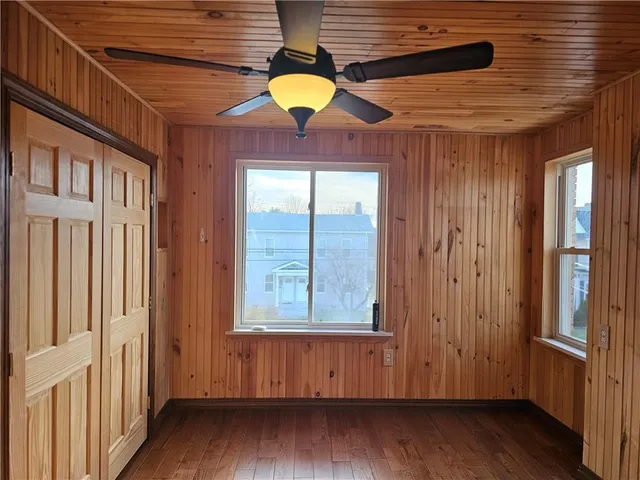 a view of an entryway with wooden floor