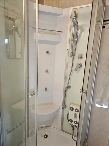 a bathroom with a bathtub and shower