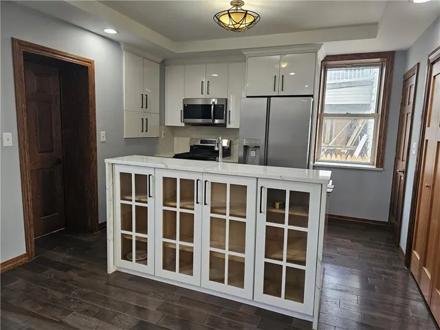 a view of kitchen with wooden floor and window