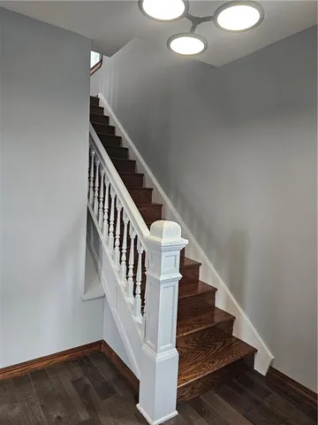 a view of entryway with wooden floor