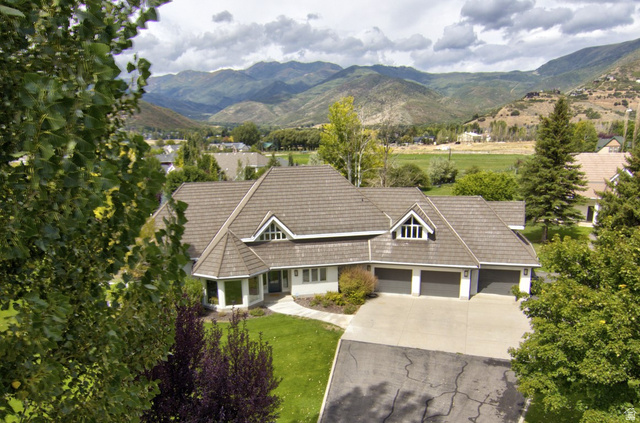 Neutral-toned exterior with multiple gables and dormer windows