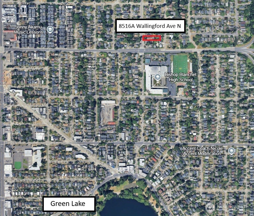 8516 Wallingford Avenue North, Unit B Seattle, WA 98103 - Photo 3 of 5 a sign that is sitting on a brick wall