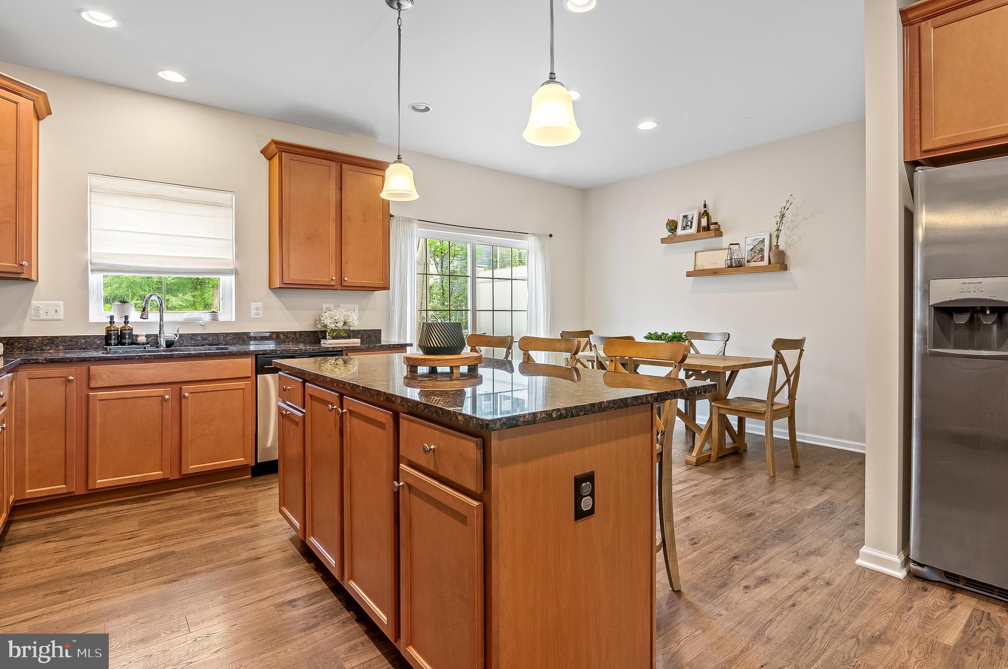 1022 Linden Drive Hanover, MD 21076 - Photo 17 of 42 a kitchen with granite countertop a sink stove and refrigerator