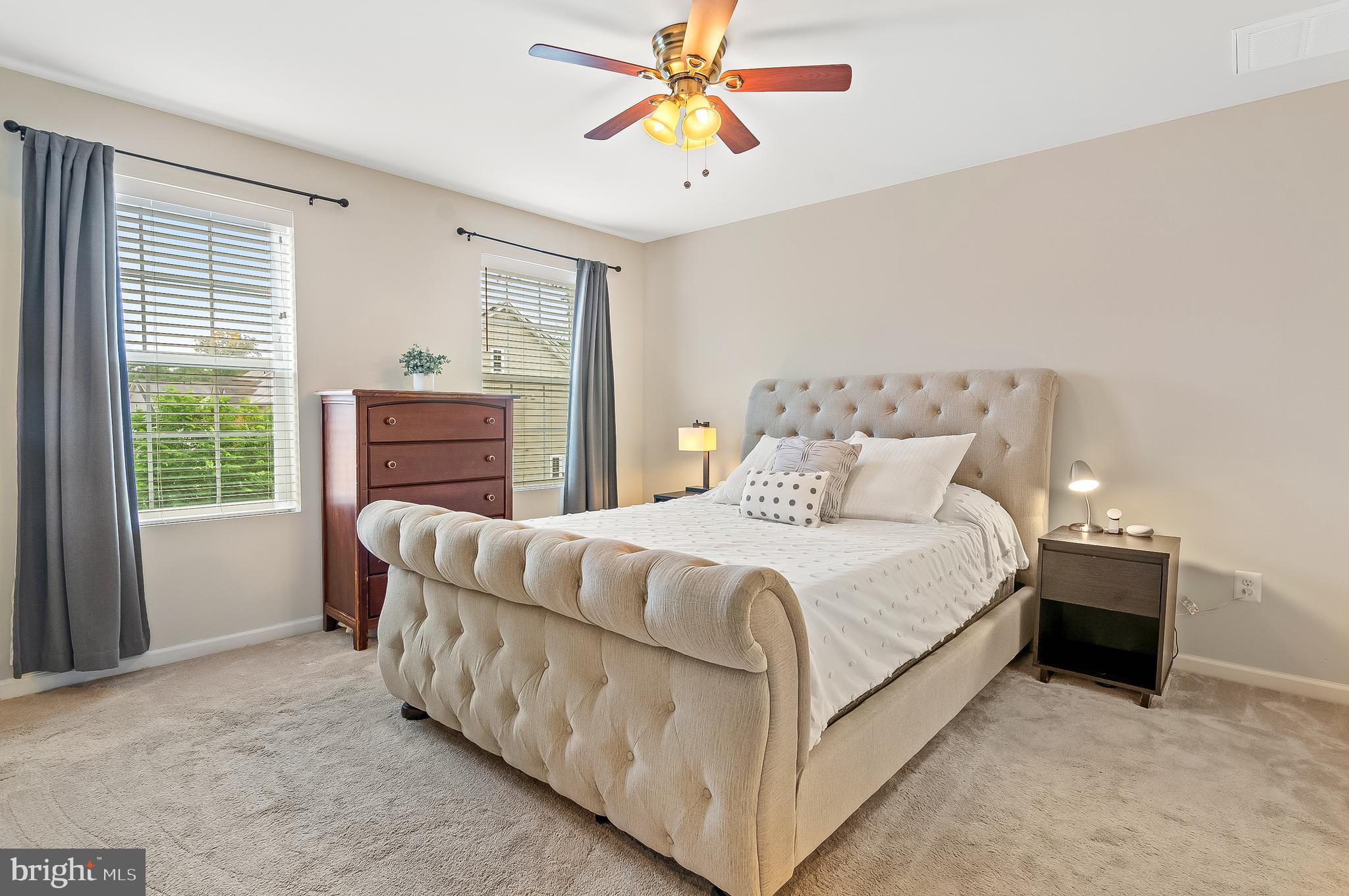 1022 Linden Drive Hanover, MD 21076 - Photo 29 of 42 a bedroom with a bed and a chandelier fan