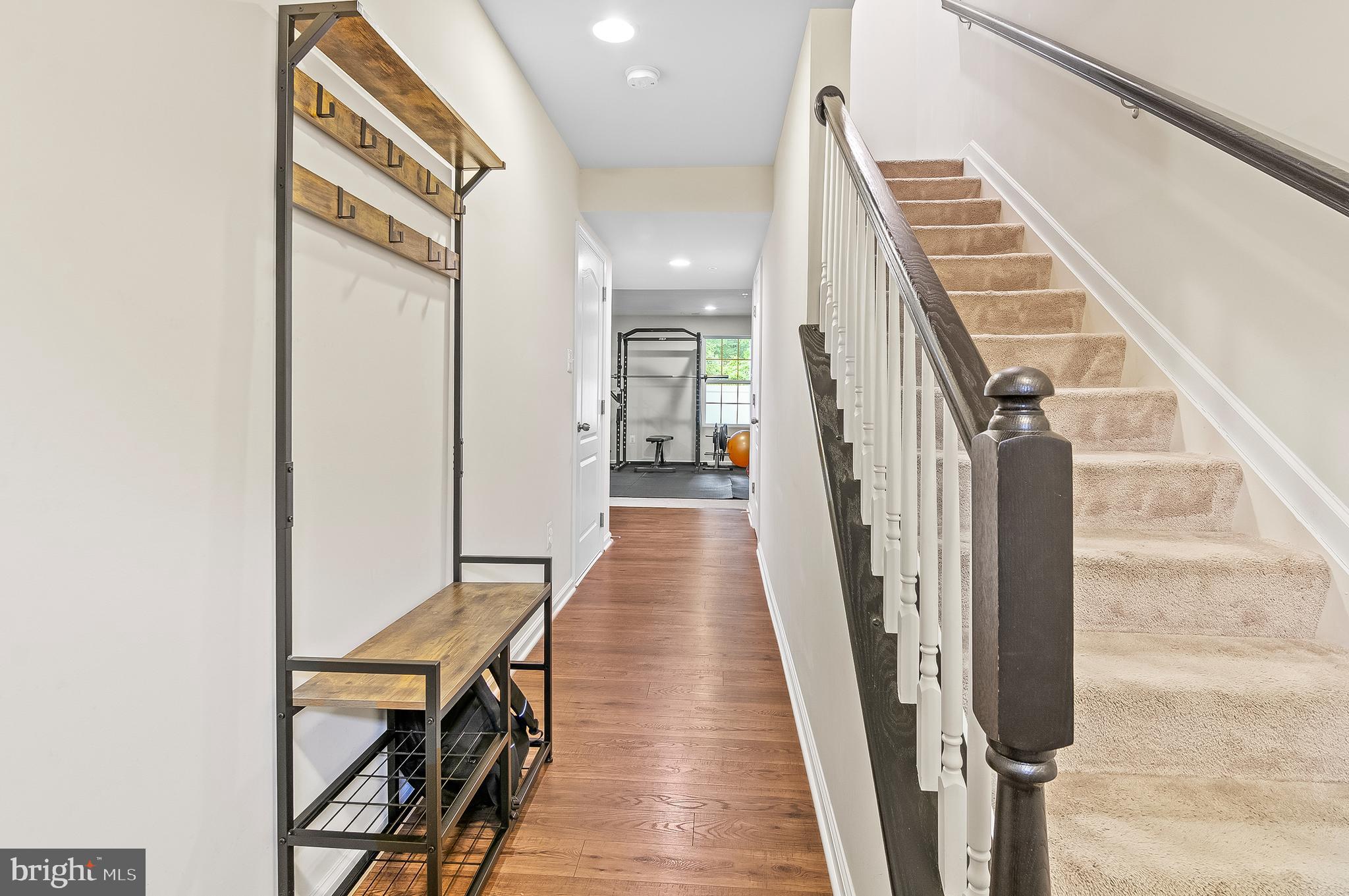 1022 Linden Drive Hanover, MD 21076 - Photo 3 of 42 a view of a hallway with wooden floor and staircase