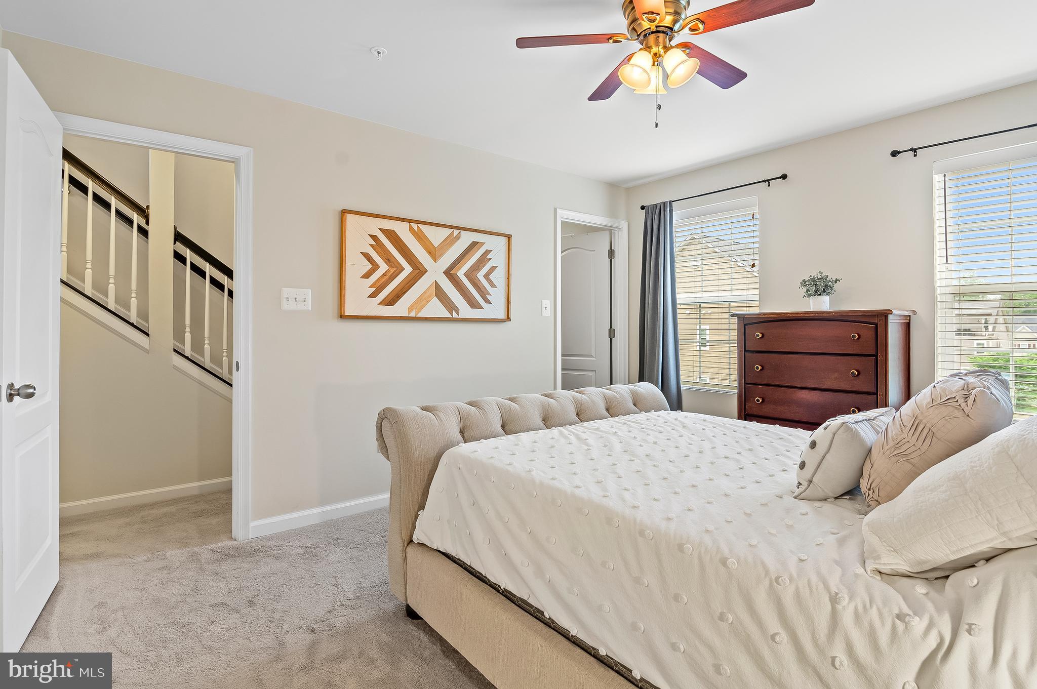 1022 Linden Drive Hanover, MD 21076 - Photo 31 of 42 a bedroom with a bed and a chandelier