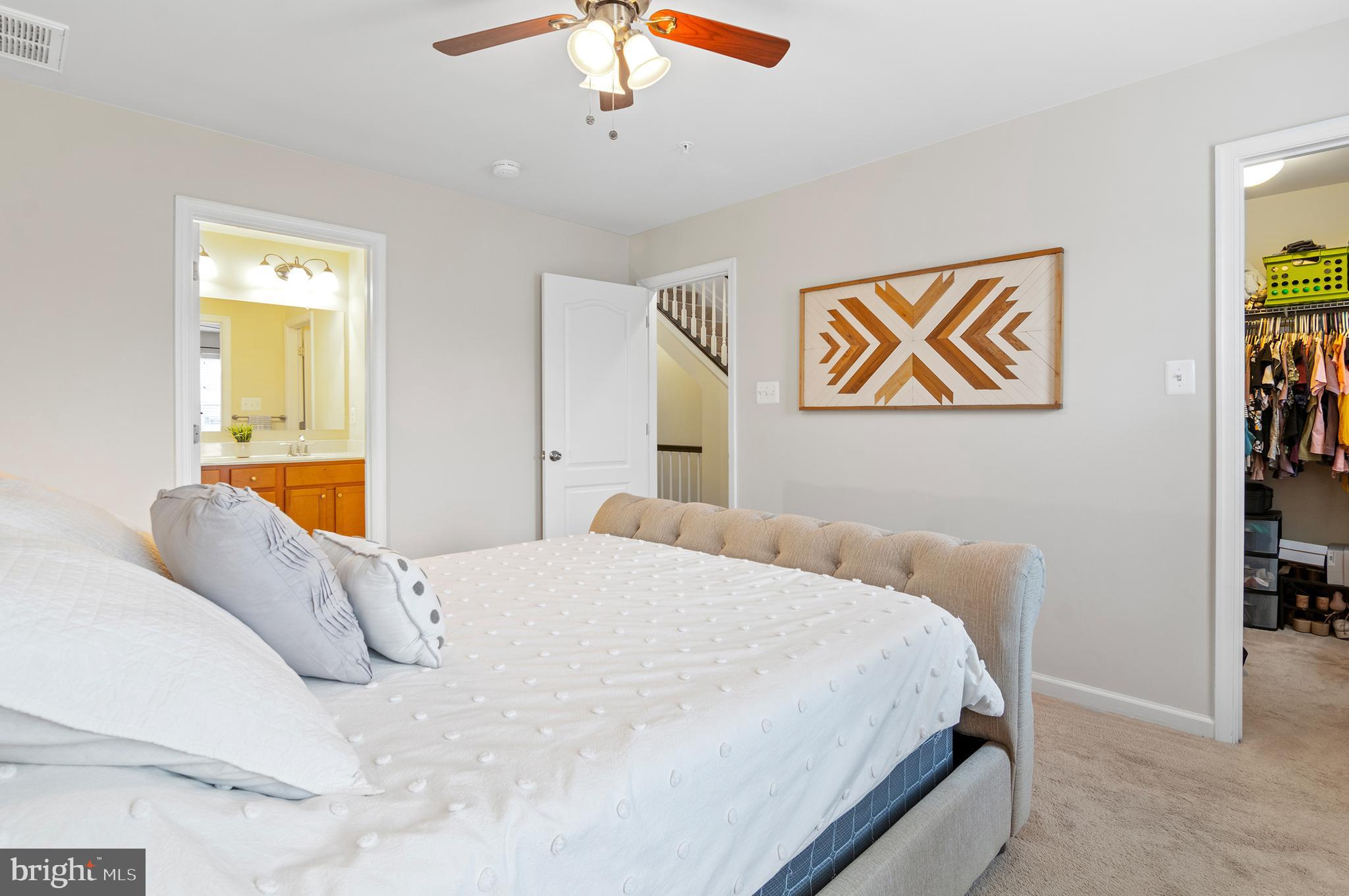 1022 Linden Drive Hanover, MD 21076 - Photo 34 of 42 a bedroom with a bed and a painting on the wall