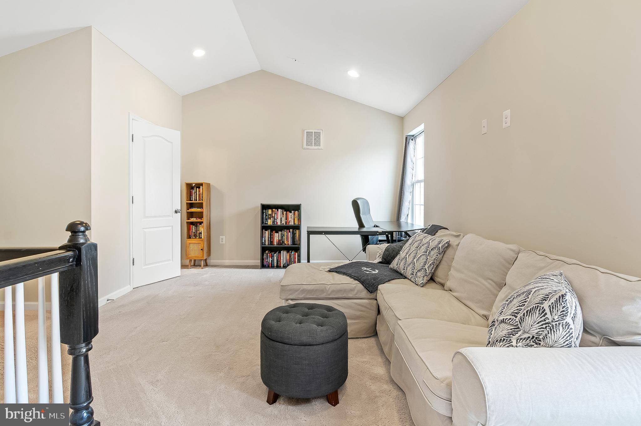 1022 Linden Drive Hanover, MD 21076 - Photo 37 of 42 a living room with furniture a couch and a large window