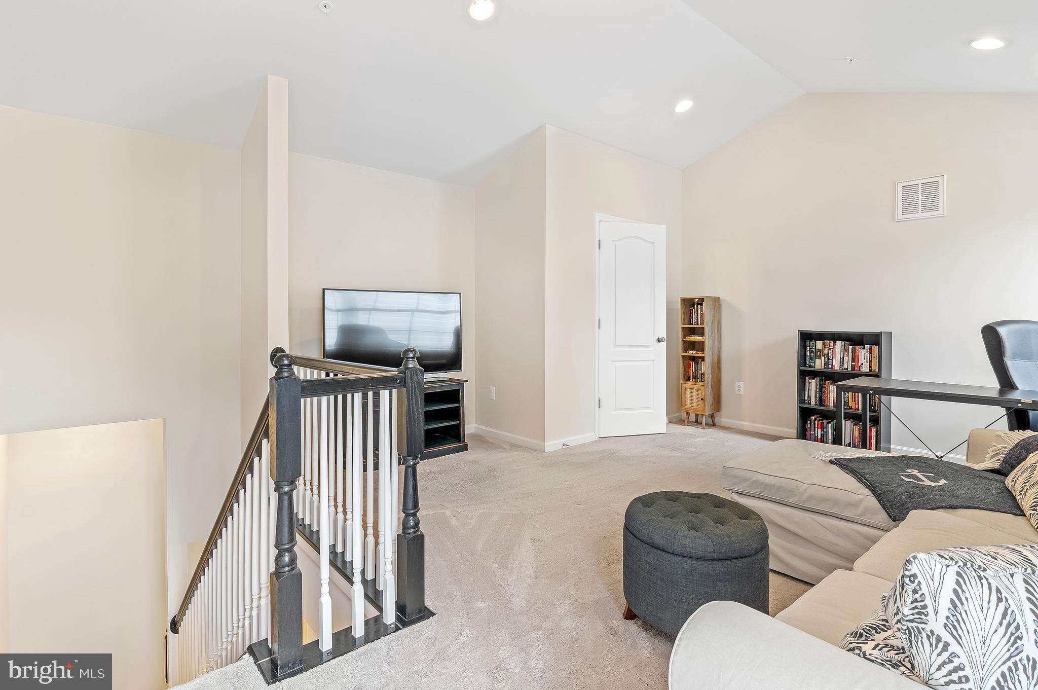 1022 Linden Drive Hanover, MD 21076 - Photo 38 of 42 a living room with furniture and a flat screen tv