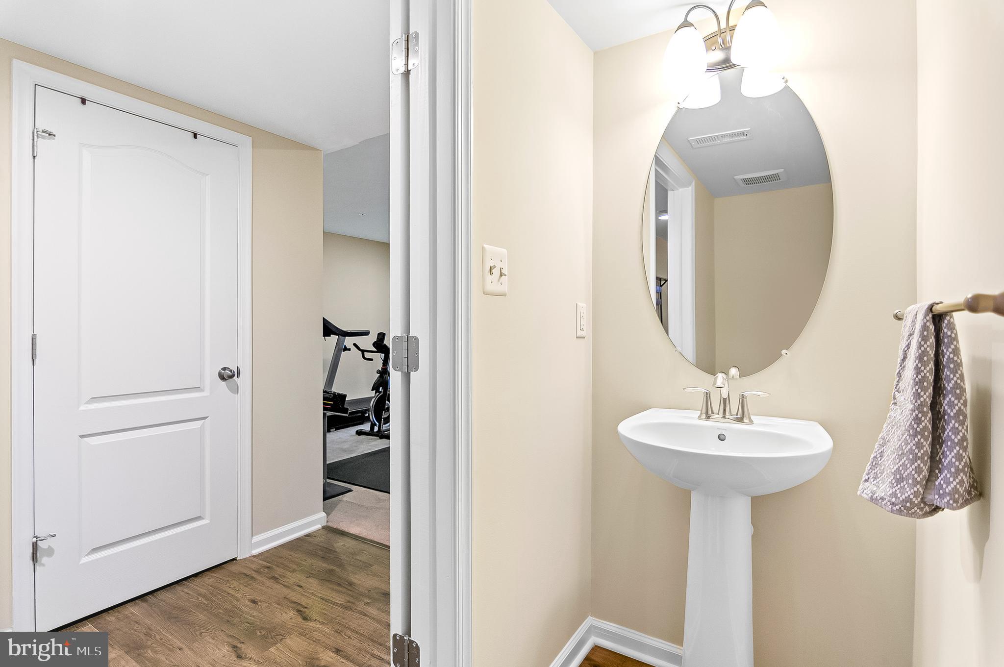 1022 Linden Drive Hanover, MD 21076 - Photo 6 of 42 a bathroom with a sink and a mirror