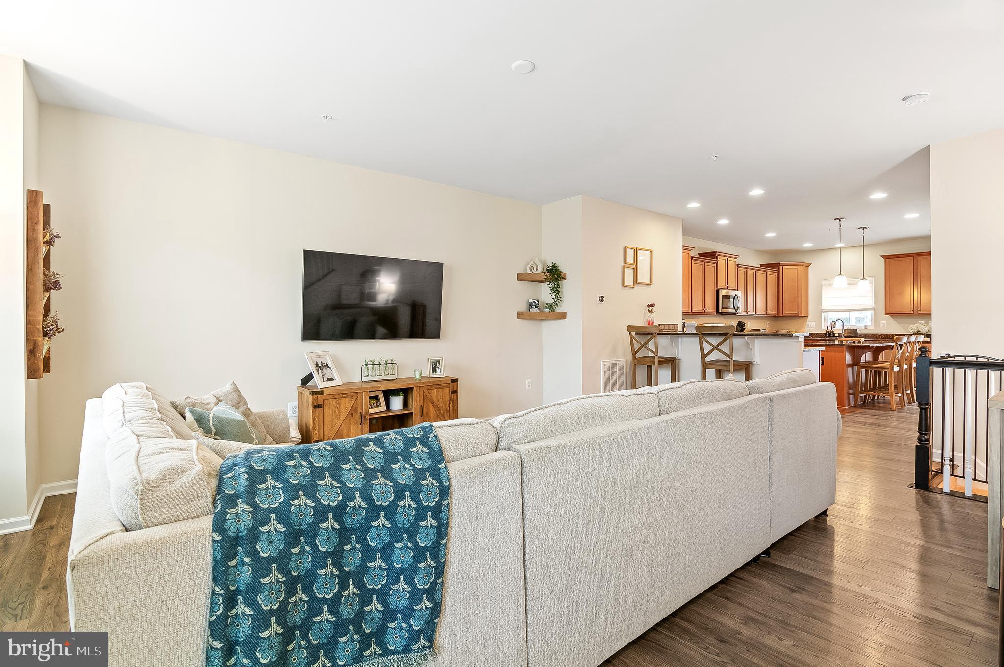 1022 Linden Drive Hanover, MD 21076 - Photo 10 of 42 a living room with furniture and a flat screen tv