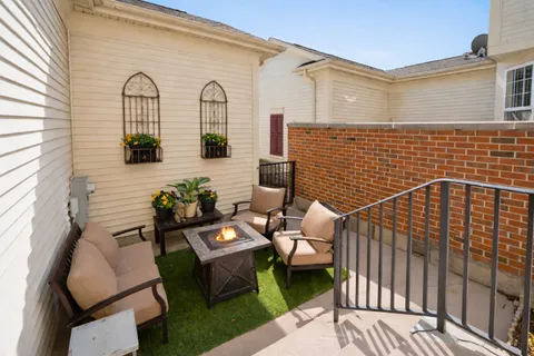 a view of a chairs with a table in the patio