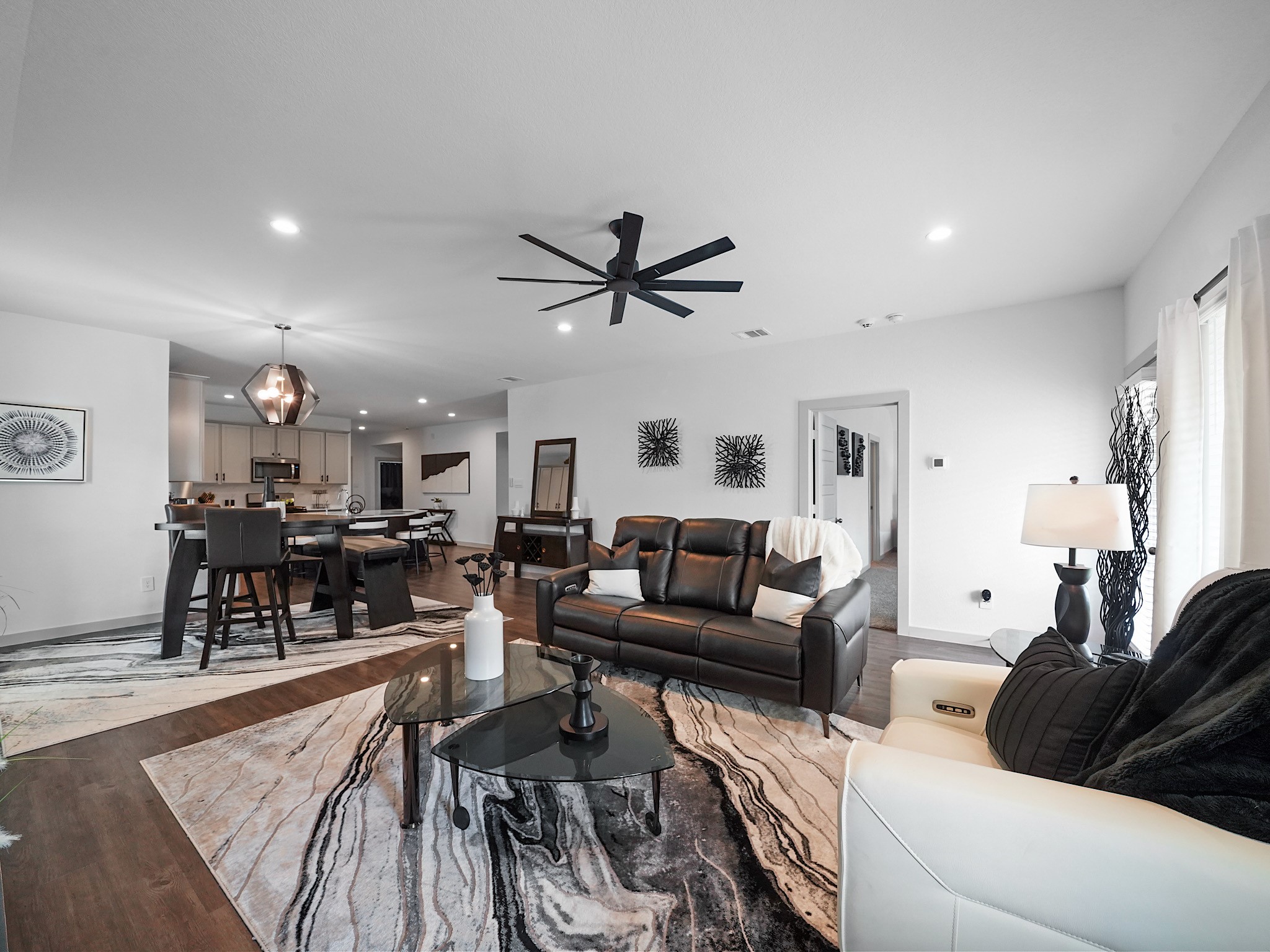 7823 Cattlewood Pass Rosharon, TX 77583 - Photo 9 of 17 The kitchen, dining, and living spaces flow seamlessly, perfect for entertaining.