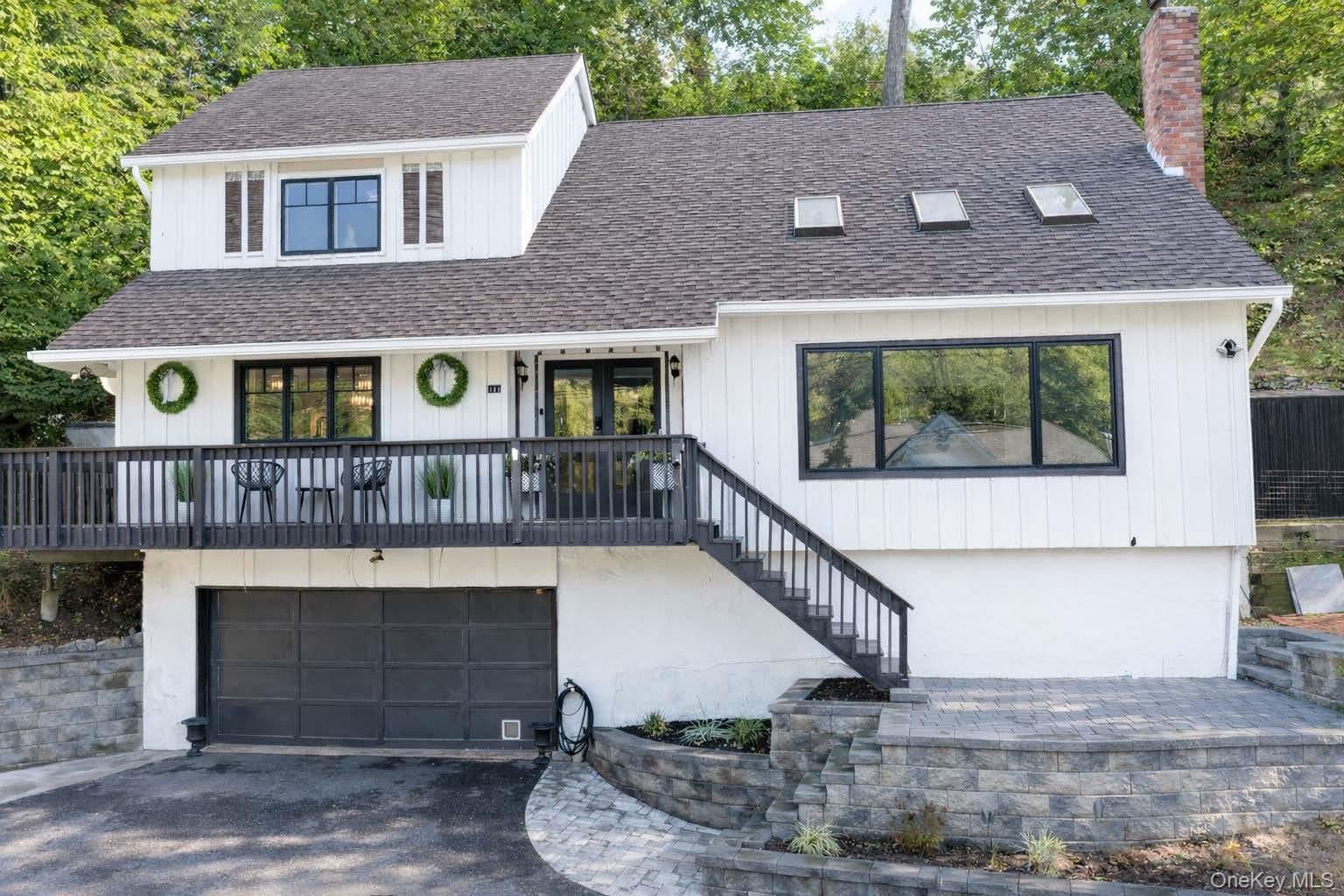 131 Fleets Cove Road Huntington, NY 11743 - Photo 1 of 41 a view of house with front door and deck