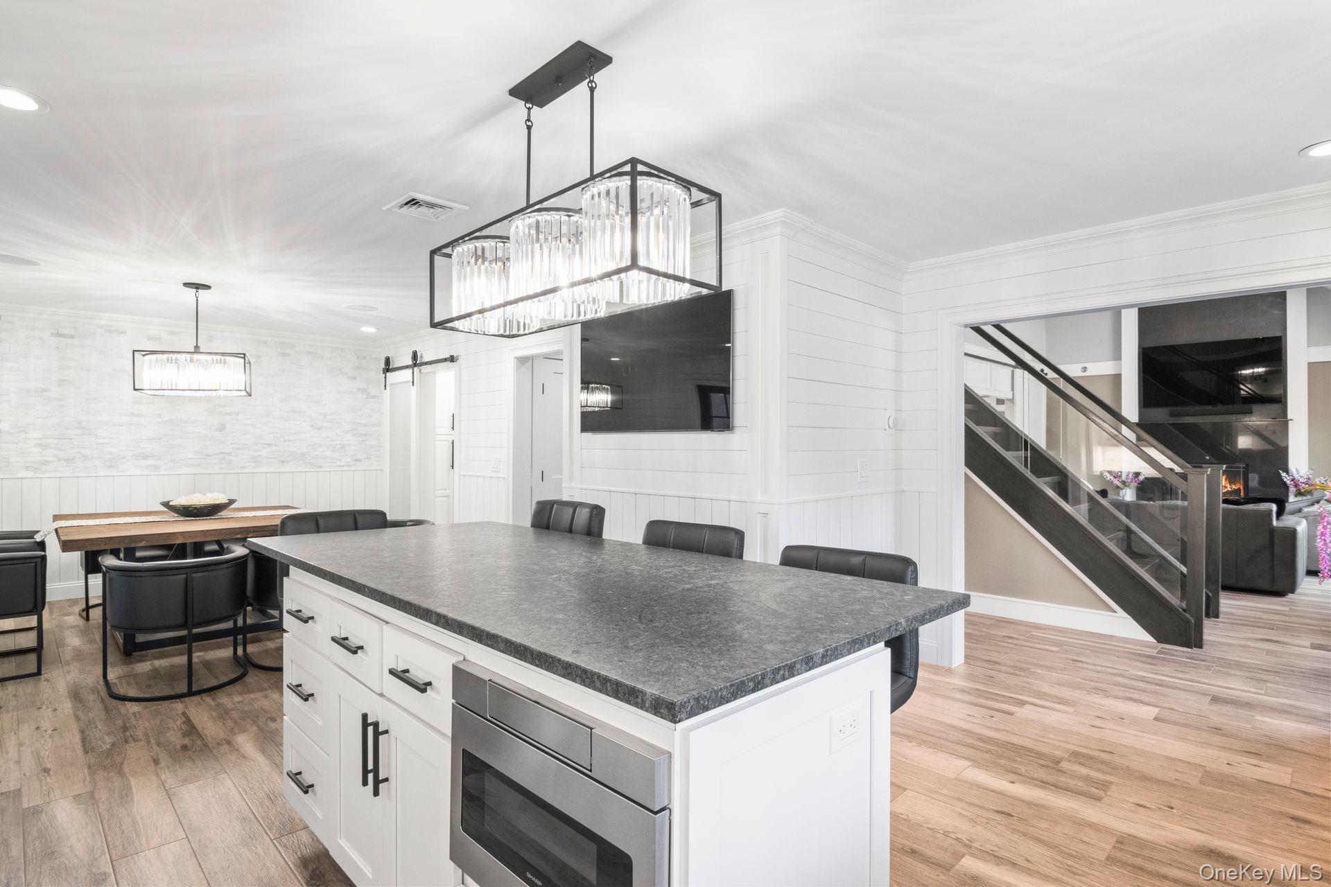 131 Fleets Cove Road Huntington, NY 11743 - Photo 41 of 41 a kitchen with a stove a sink and a refrigerator