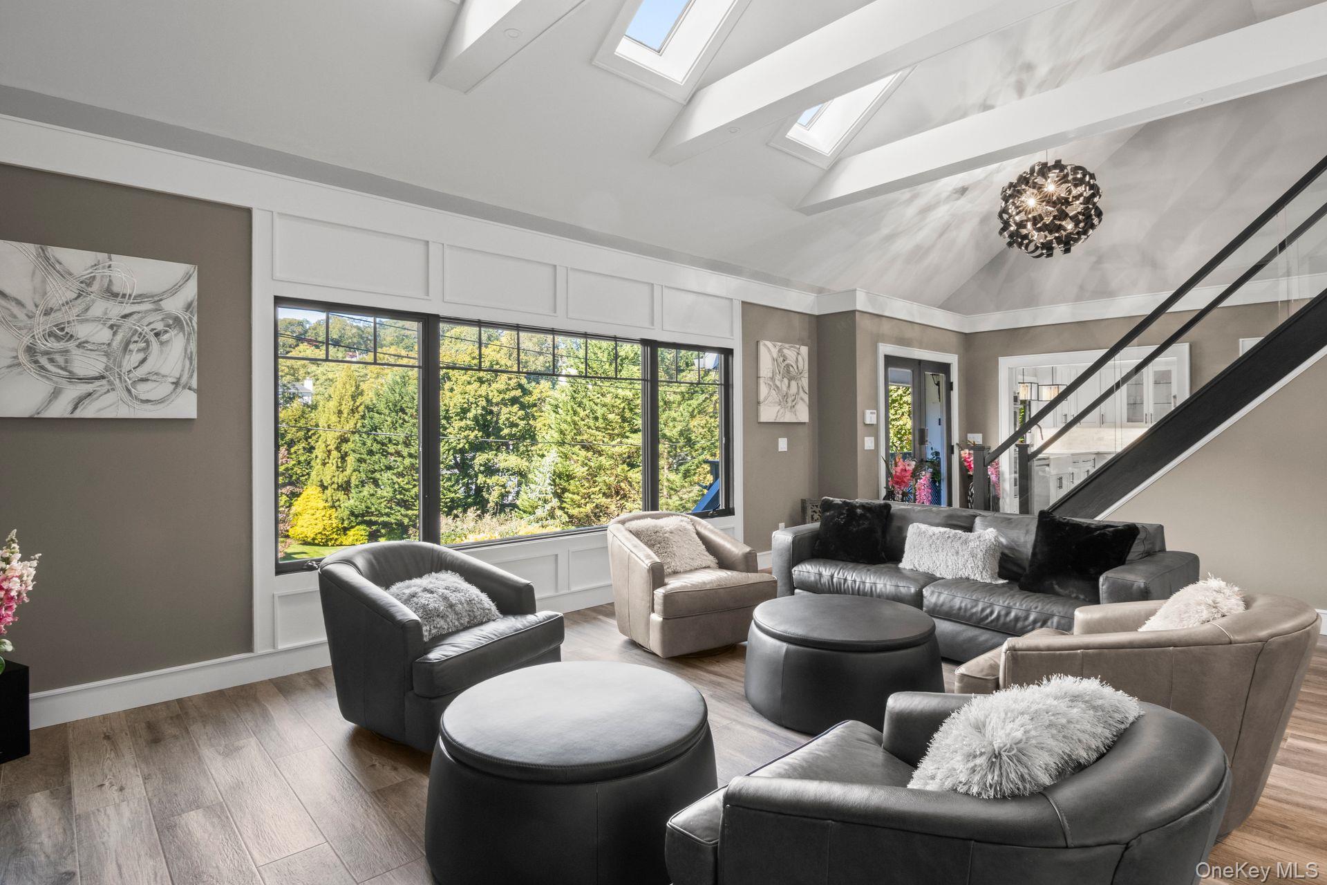 131 Fleets Cove Road Huntington, NY 11743 - Photo 13 of 41 a living room with furniture and a large window