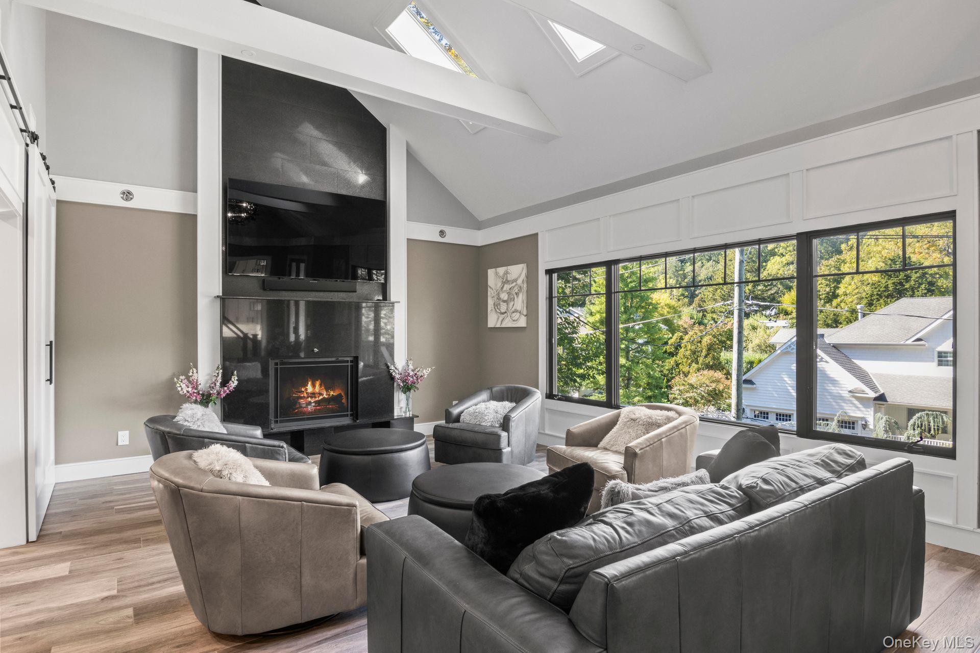 131 Fleets Cove Road Huntington, NY 11743 - Photo 14 of 41 a living room with furniture and a fireplace